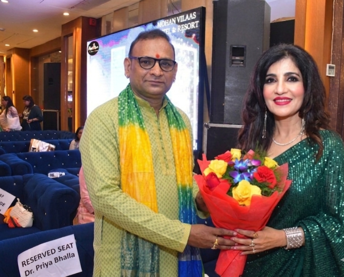 Felicitation with a bouquet at the Mohan Vilaas event
